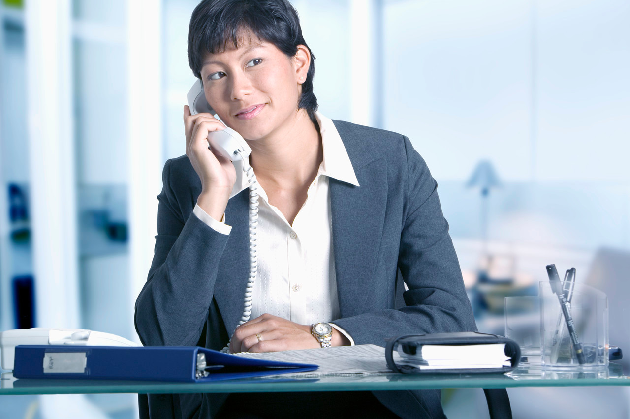 Businesswoman Using Telephone