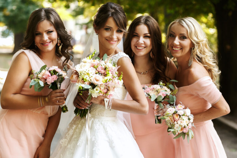 Bride,With,Bridesmaids,On,The,Park,On,The,Wedding,Day