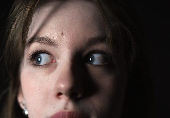 Close-up,Of,Frightened,Eyes,Of,A,Young,Woman,On,A