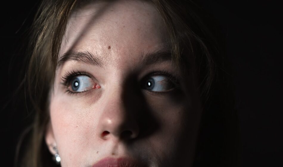 Close-up,Of,Frightened,Eyes,Of,A,Young,Woman,On,A